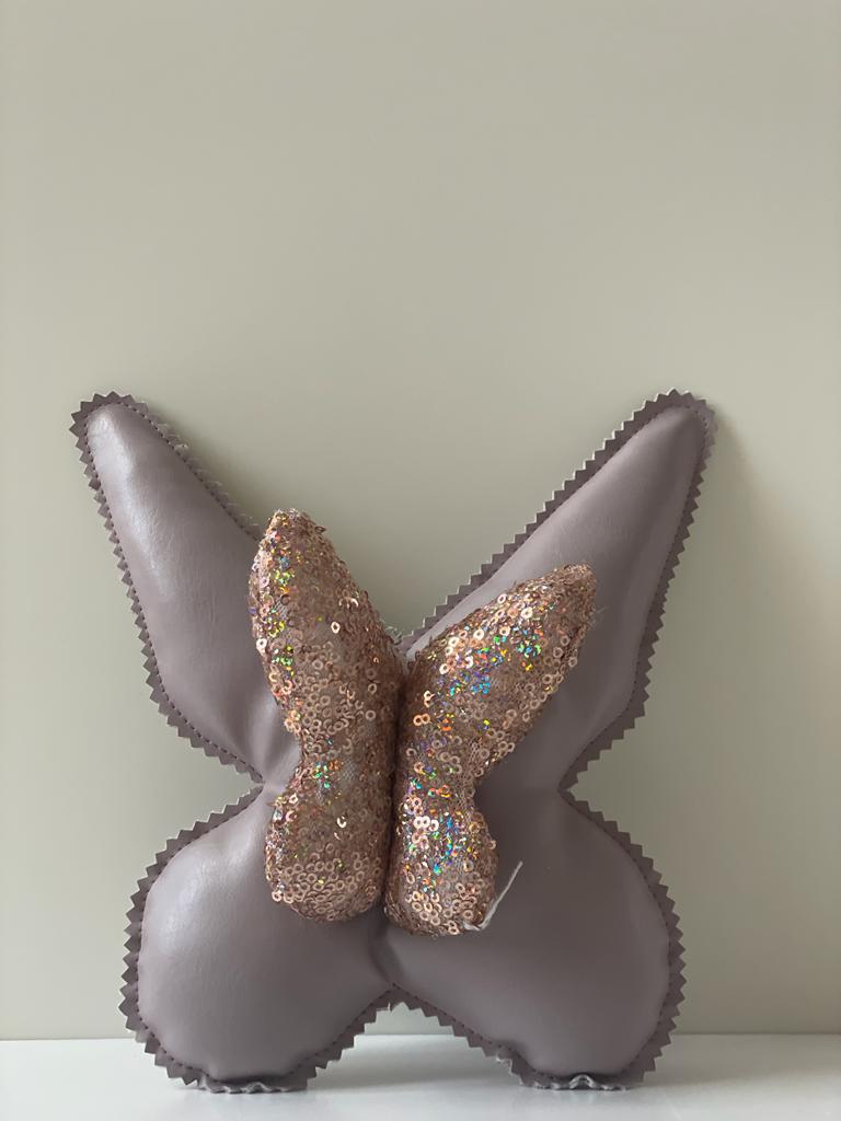 Cuscino farfalla in pelle e paillettes