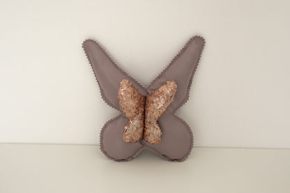 Cuscino farfalla in pelle e paillettes