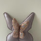 Cuscino farfalla in pelle e paillettes